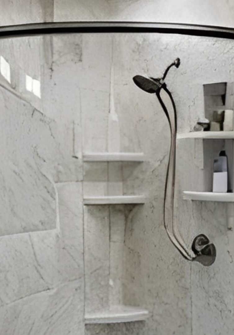 Modern shower with marble walls and built-in shelves.